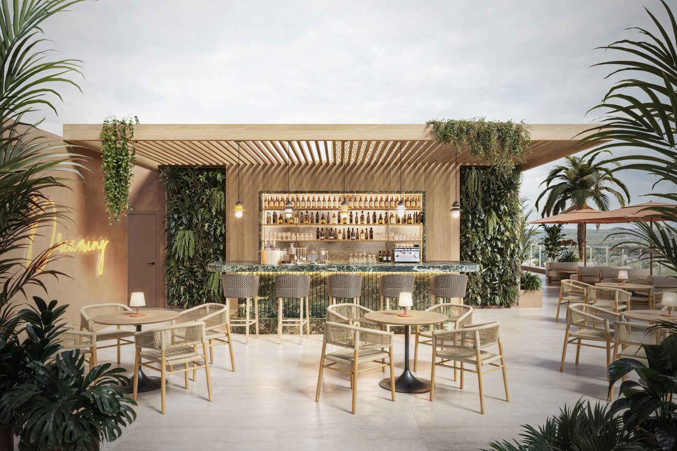 Rooftop bar with green marble counter, rattan chairs, wooden slatted pergola, living plant walls, and palm trees.